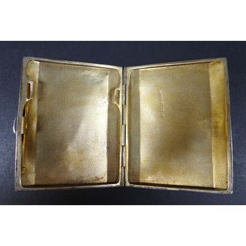 32 - Four Victorian and later silver cigarette cases, comprising an Edwardian case with bright cut decora... 