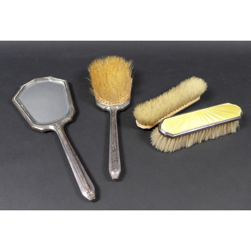 6 - An Art Deco silver and yellow enamel backed dressing table set, decorated with wavy lined guilloche ... 