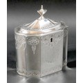A George III silver tea caddy, of decagon section with caddy top and small urn finial, decorated wit... 