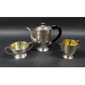 An Art Deco Anglo-Indian silver three piece bachelors tea service, circa 1925, of tapering cylindric... 