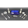 A small group of silver items, comprising a George V silver muffin slice and fork, Josiah Williams &... 