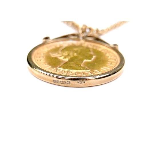 69 - An Elizabeth II gold sovereign, 1958, contained within 9ct gold pendant mount, on a 9ct gold chain, ... 