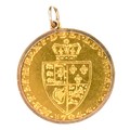 A 1794 George III spade guinea, in a 9ct gold hallmarked mount, 3.2cm including mount and loop, 9.6g... 