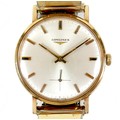 A Longines 9ct gold gentleman's wristwatch, circa 1970s, circular silvered dial with gold batons, lo... 