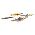 A group of four 9ct gold brooches set with amethysts and pearls, all Victorian/Edwardian, largest 4.... 