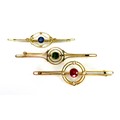 A group of three 9ct gold bar brooches of target design, each set with a coloured stone to the centr... 