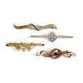 A group of four 9ct gold brooches, including one of Art Deco design with white stones in a white gol... 