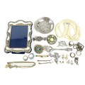 A small group of jewellery and silver items, including a silver photograph frame, 14 by 10cm, an 830... 