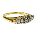 An 18ct gold five stone diamond ring, the stones of graduated size, largest of approximately 2mm dia... 