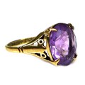 A 9ct gold and amethyst dress ring, 19th century, the oval cut stone of approximately 10 by 8mm, a/f... 