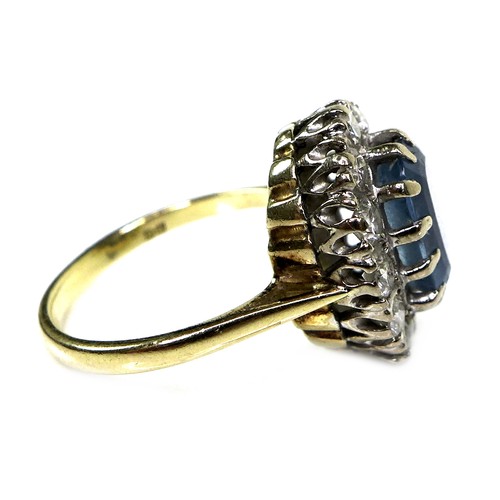 265 - A 9ct yellow gold dress ring, set with an oval cut pale blue stone, possibly topaz, approximately 10... 