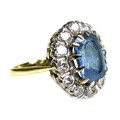 A 9ct yellow gold dress ring, set with an oval cut pale blue stone, possibly topaz, approximately 10... 