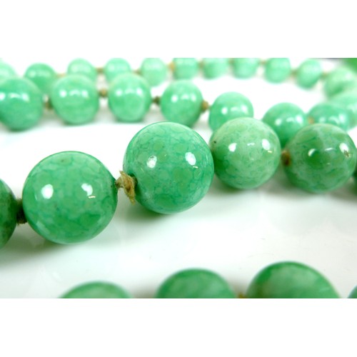 257 - Two jade necklaces, the first a string of graduating round beads, largest bead approximately 1.4cm d... 