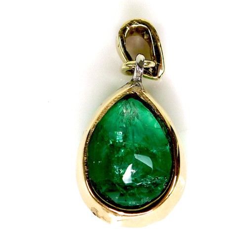 285 - An 18ct gold and emerald pendant, the pear shaped stone 14 by 11 by 7.7mm, a/f, with 1.5mm diamond t... 