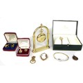 A small group of jewellery and watches, comprising a Victorian 9ct gold mounted cameo brooch, 44 by ... 
