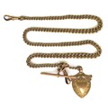 A 9ct gold Albert chain, each link marked, with 9ct gold shield pendant, 25.8g overall, 39cm long.