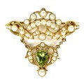 A gold, cultured pearl and green stone brooch, the pear cut stone on suspended drop, possibly a peri... 