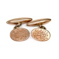 A pair of Edward VII 9ct gold cufflinks, of oval form with engraved monogram, chain links to torpedo... 