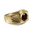 A 9ct gold and garnet gentleman's ring, single round cut stone, 6.0 by 3.0mm, 12.5mm wide, size O/P,... 