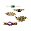 A group of three 9ct rose gold bar brooches, one set with garnets and seed pearls in a clover design... 