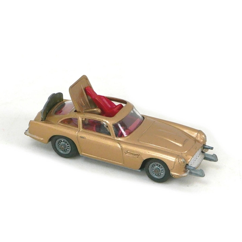 145 - Three Dinky Toys die-cast toy models, comprising a James Bond DB5 in gold, a 447 Walls Ice Cream van... 