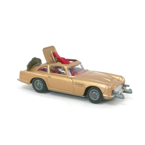 145 - Three Dinky Toys die-cast toy models, comprising a James Bond DB5 in gold, a 447 Walls Ice Cream van... 