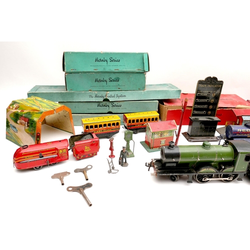 150 - A collection of O gauge tinplate railway, early 20th century, including a clockwork Bassett-Lowke 4-... 