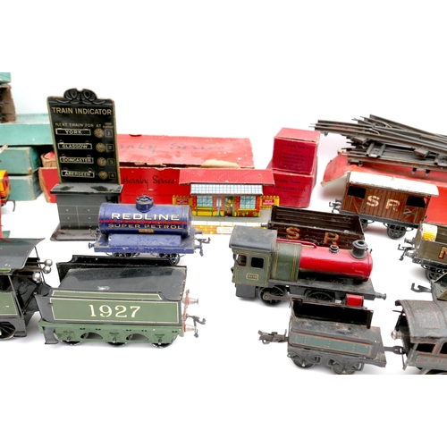 150 - A collection of O gauge tinplate railway, early 20th century, including a clockwork Bassett-Lowke 4-... 