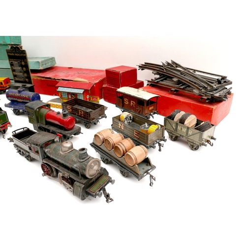 150 - A collection of O gauge tinplate railway, early 20th century, including a clockwork Bassett-Lowke 4-... 