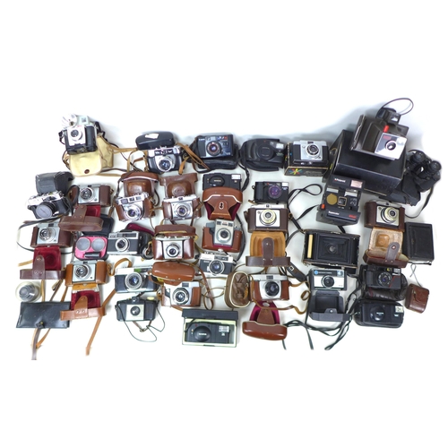 157 - A collection of retro cameras and accessories, including two Polaroid cameras, a Super Swinger Land ... 