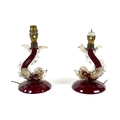 A pair of vintage Murano cranberry and clear glass table lamp bases, circa 1950, each modelled as a ... 