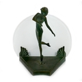 An Art Deco bronze table lamp, in the style of Max Le Verrier, modelled as a young female nude stand... 