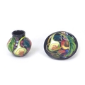Two Moorcroft pottery Queens pattern pieces, comprising a small baluster vase, 8 by 8cm high, with b... 