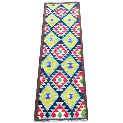 230 - A Maimana Kilim runner, with diamond patterned ground, yellow, red, blue, green, and white, encased ... 