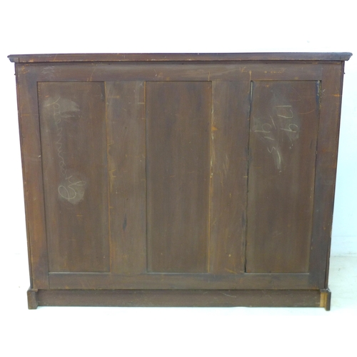 242 - An Edwardian mahogany bookcase, blind carved frieze above three glazed doors, enclosing shelves, mir... 