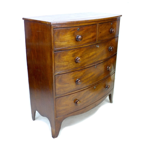 246 - A Victorian bow fronted mahogany chest of drawers, with two over three drawers, raised on splayed su... 