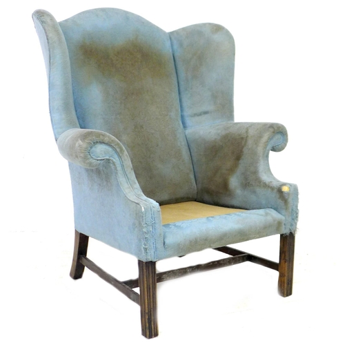 248 - Two wingback armchairs, comprising a Georgian style wingback armchair, in blue floral fabric, a/f up... 