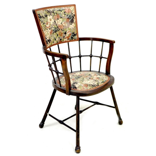 253 - An Arts & Crafts bobbin armchair, with floral upholstered seat and back, raised on splayed legs with... 