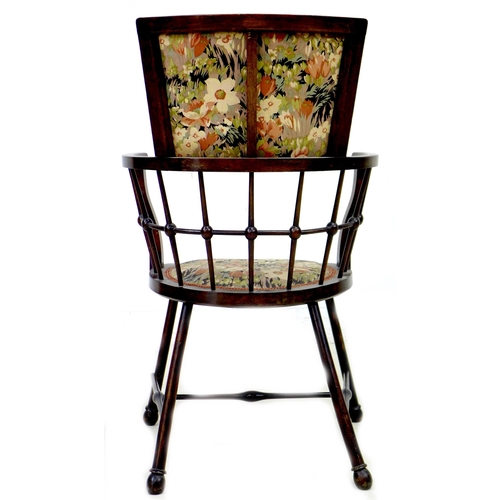 253 - An Arts & Crafts bobbin armchair, with floral upholstered seat and back, raised on splayed legs with... 