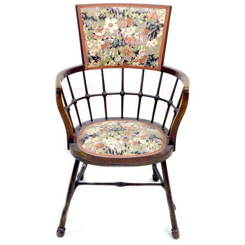 253 - An Arts & Crafts bobbin armchair, with floral upholstered seat and back, raised on splayed legs with... 