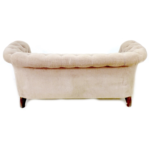 255 - A Chesterfield two seater settee, early 20th century, upholstered in button back beige fabric, raise... 