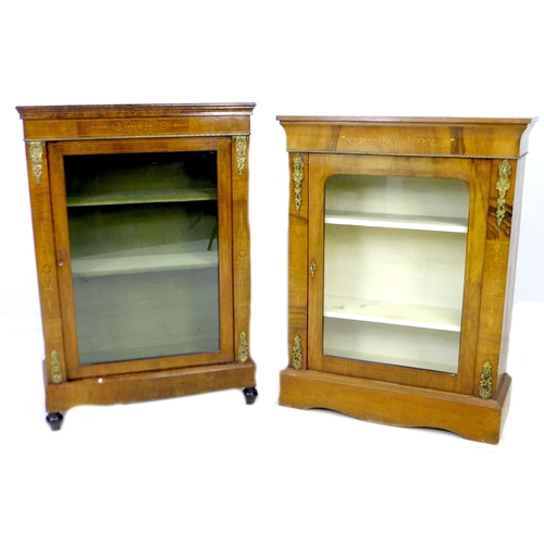 259 - Two Victorian walnut inlaid display cabinets, with glazed doors, brass ormalu mounts and two shelves... 