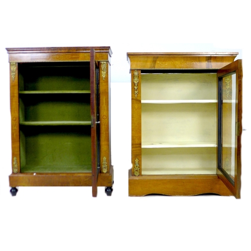 259 - Two Victorian walnut inlaid display cabinets, with glazed doors, brass ormalu mounts and two shelves... 