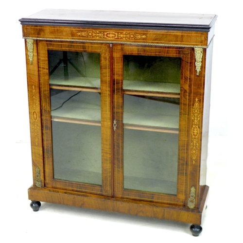 260 - A Victorian walnut inlaid display cabinet, with glazed twin doors enclosing two shelves, decorated w... 