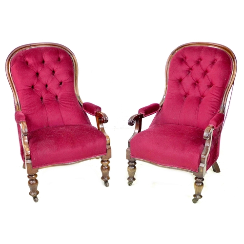 262 - A pair of Victorian mahogany buttonback nursing chairs, upholstered in a claret material, with cushi... 