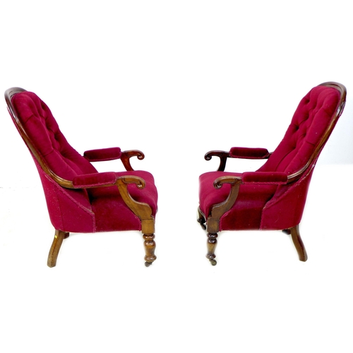 262 - A pair of Victorian mahogany buttonback nursing chairs, upholstered in a claret material, with cushi... 