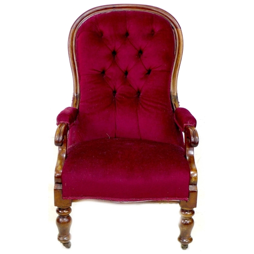 262 - A pair of Victorian mahogany buttonback nursing chairs, upholstered in a claret material, with cushi... 