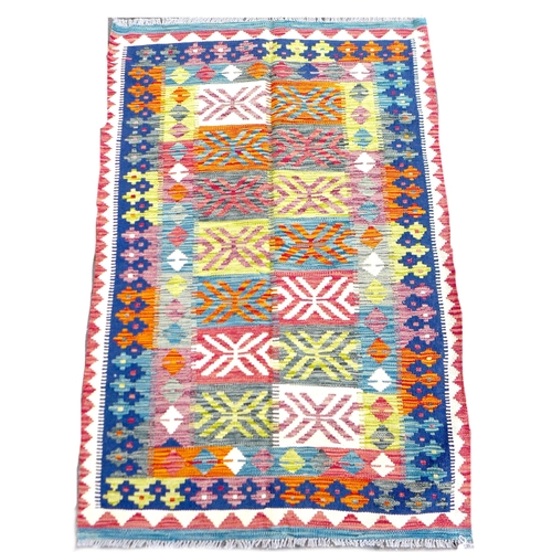 264 - A Chobi Kilim rug, the multicolour ground with fourteen rectangular panels, and stylized geometric b... 