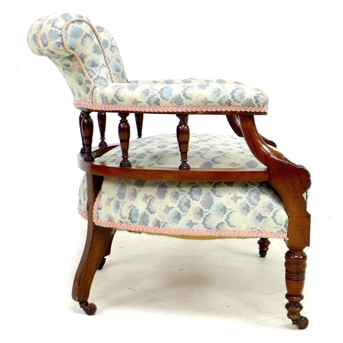 266 - A Victorian mahogany tub chair, with spindle supported scroll back, overstuffed in pale blue fabric ... 