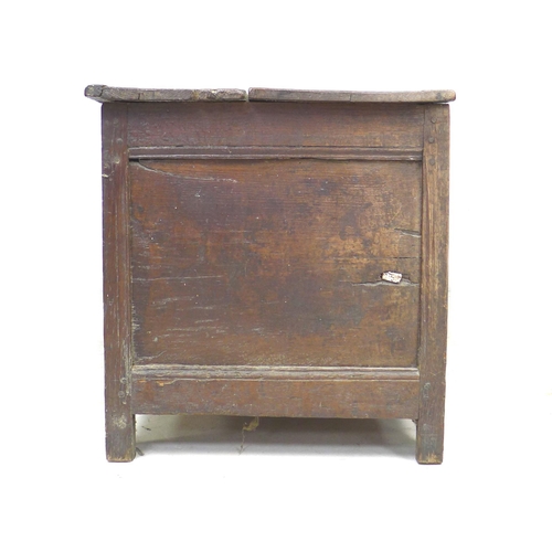 273 - An 18th century three panelled oak coffer, with lift lid, raised on straight legs, modern brass hing... 